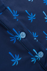 Close-up of a navy blue button-up shirt with a light blue palm tree pattern and matching buttons.