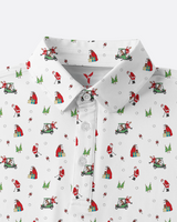 A white short-sleeve collared button-up shirt with an all-over Christmas golf-themed print featuring Santa Claus, golf carts, trees, and snowflakes.
