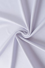 A close-up of light lavender or pale purple fabric arranged in a spiral drape, showing the material's smooth texture and soft folds.